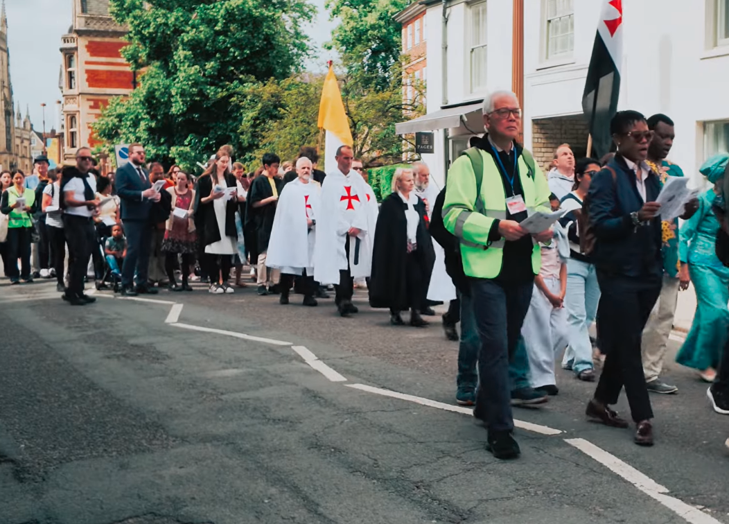A Corpus Christi Procession is taking place in Cambridge, England.